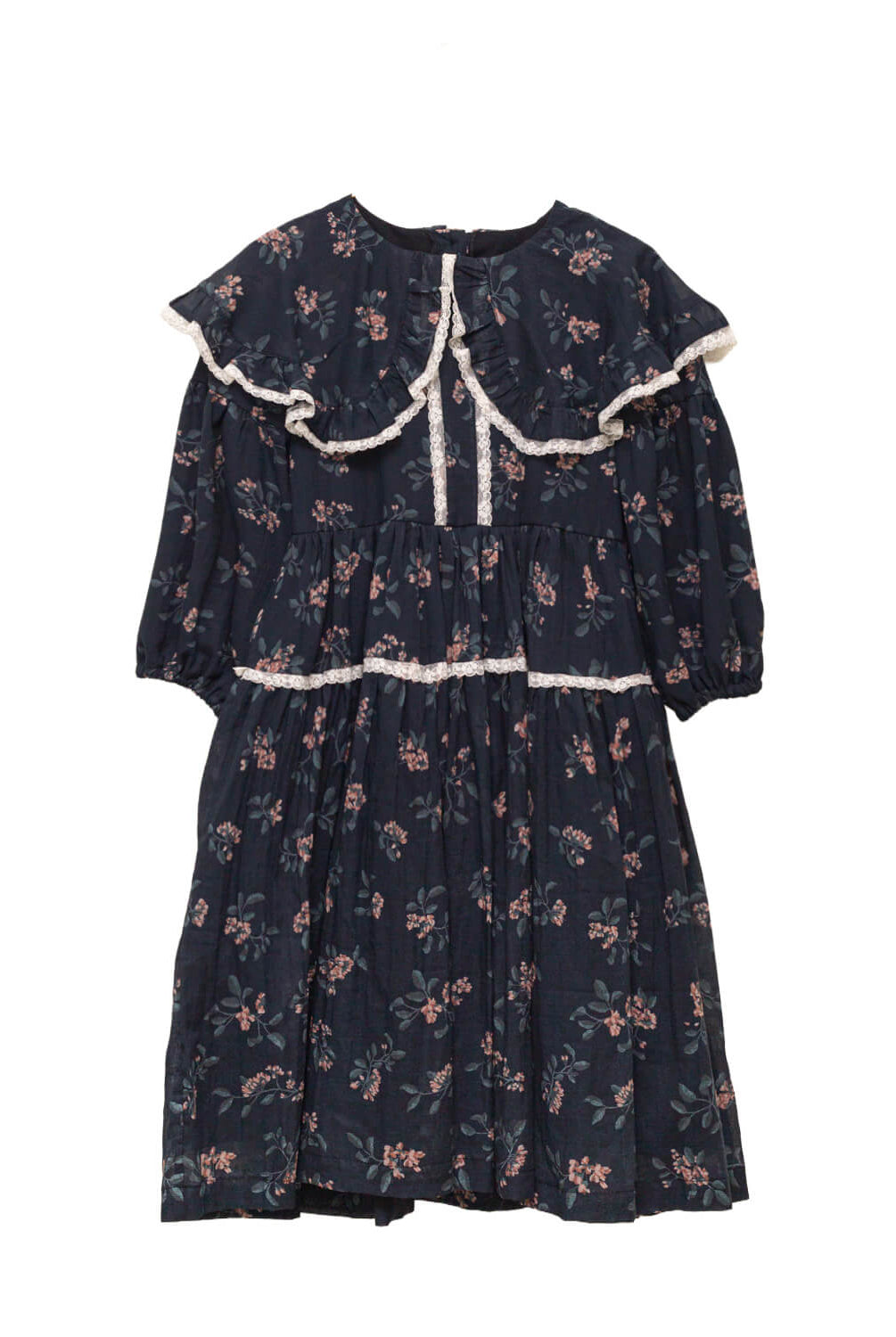 Vestido infantil romántico de voile de algodón azul noche con estampado floral y detalles de encaje Valencienne. Un diseño especial y atemporal.