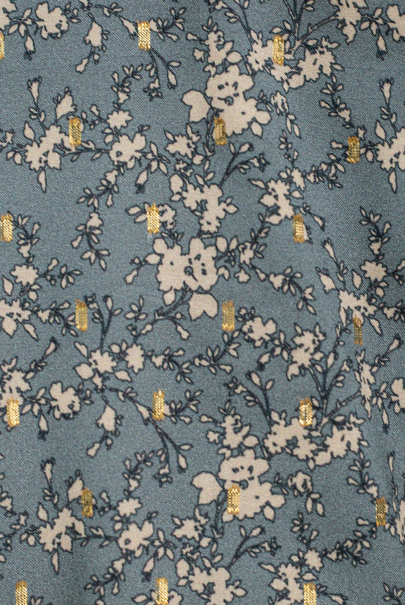 Blusa adolescente azul grisaceo con flores en beige y oro Cosmosophie