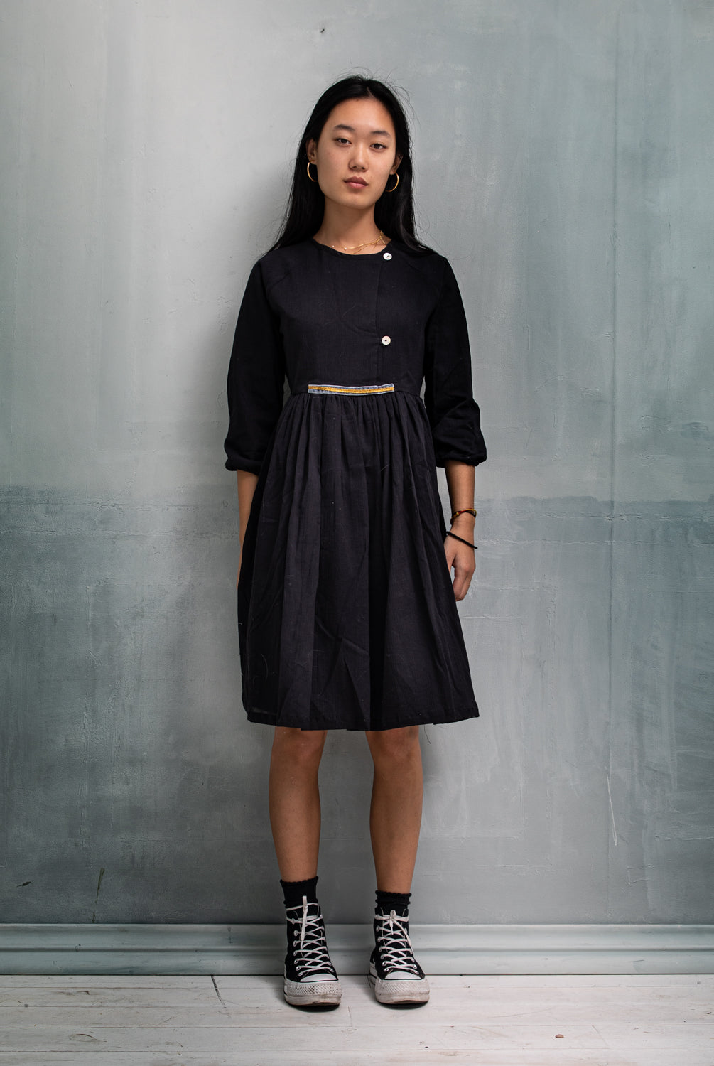 Modest dress in black. Long sleeve. Crossed chest. Velvet and gold detail. European brand dresses