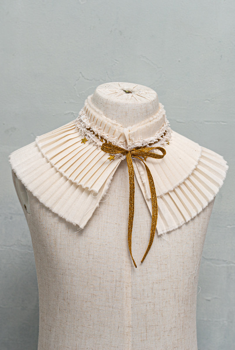 pleated collar with gold bow and stars detail