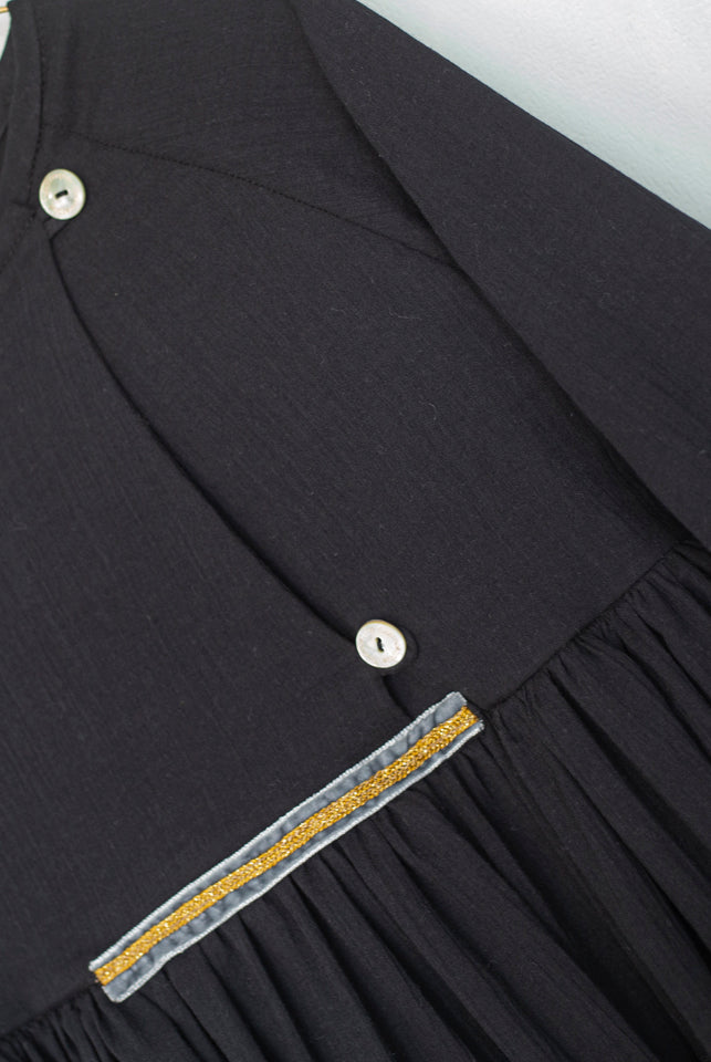 Modest dress in black. Long sleeve. Crossed chest. Velvet and gold detail. European brand dresses