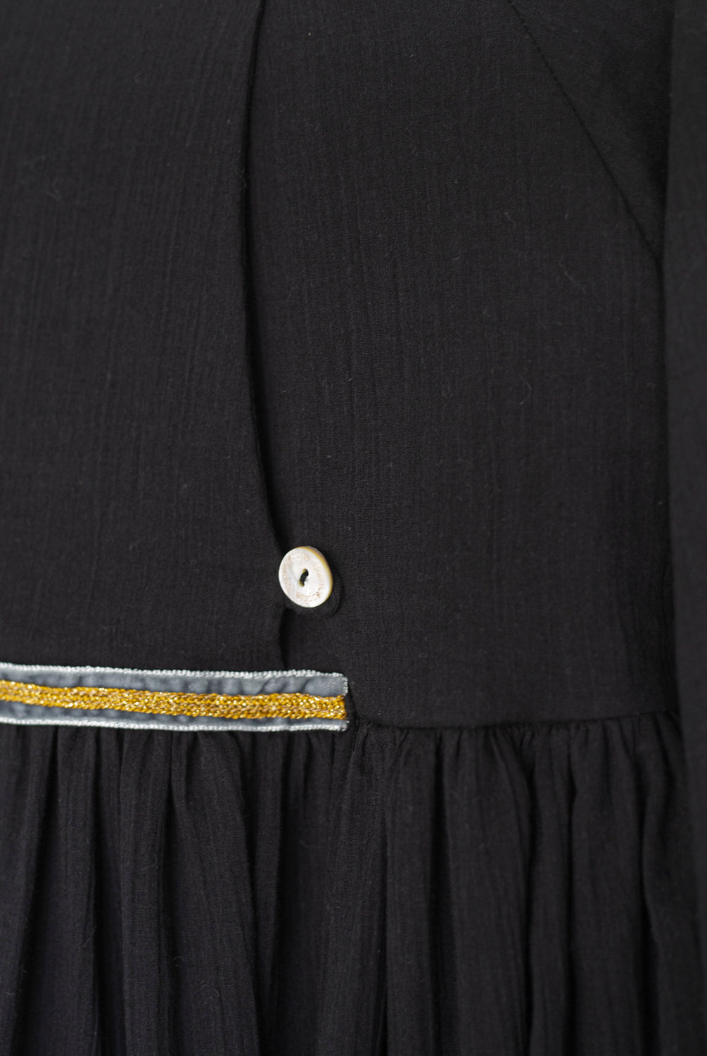 Modest dress in black. Long sleeve. Crossed chest. Velvet and gold detail. European brand dresses