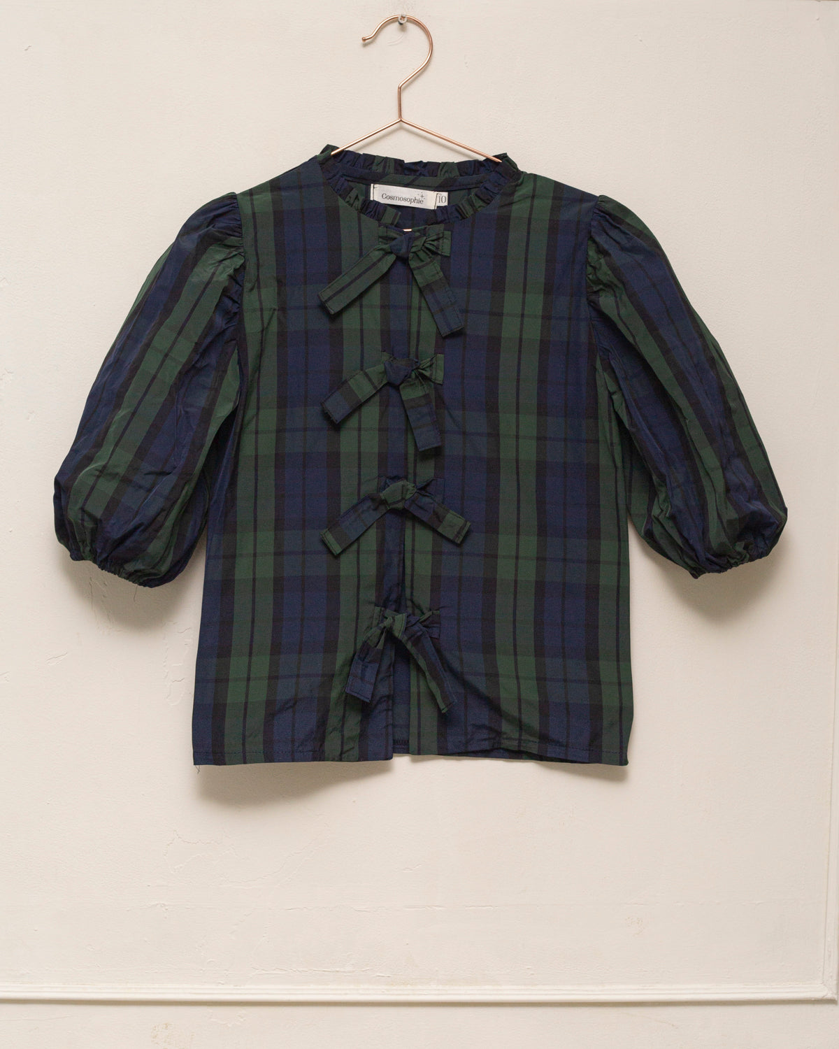 Blusa elegante para niña de cuadros con mangas abullonadas y lazadas delanteras. Diseño atemporal de Cosmosophie para ocasiones especiales.