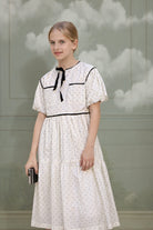 Vestido de florecitas en crudo con flores y detallen en negro. Trajes de invitada para niñas y adolescentes Boda, Primera Comunion Cosmosophie