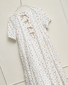 Vestido elegante de invitada para niña y adolescente de flores y puntos dorados. Con lazos en el pecho para bautizo boda o comunion. Cosmosophie