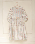 Vestido elegante para niña de algodón con estampado floral vintage, mangas abullonadas y lazo en la cintura. Diseño atemporal de Cosmosophie para ocasiones especiales.
