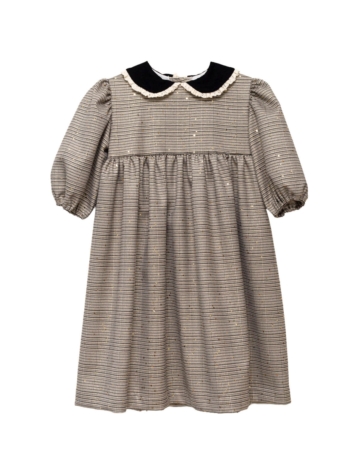 Vestido Tola de niña en cuadro de Gales con lentejuelas, cuello de terciopelo y mangas abullonadas. Diseño romántico y sofisticado.