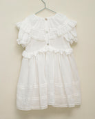 Traje de arras en blanco con encajes y gran cuello y volantes Yves Cosmosophie