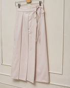 Falda beige plisada para adolescente