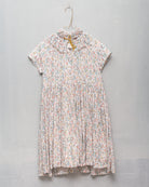 Vestido de invitada para niña en viscosa de flores y puntos dorados. para bautizo boda o comunión Cosmosophie