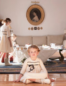 Vestido crcudo con detalles y lazo en negro Palais Cosmosophie.