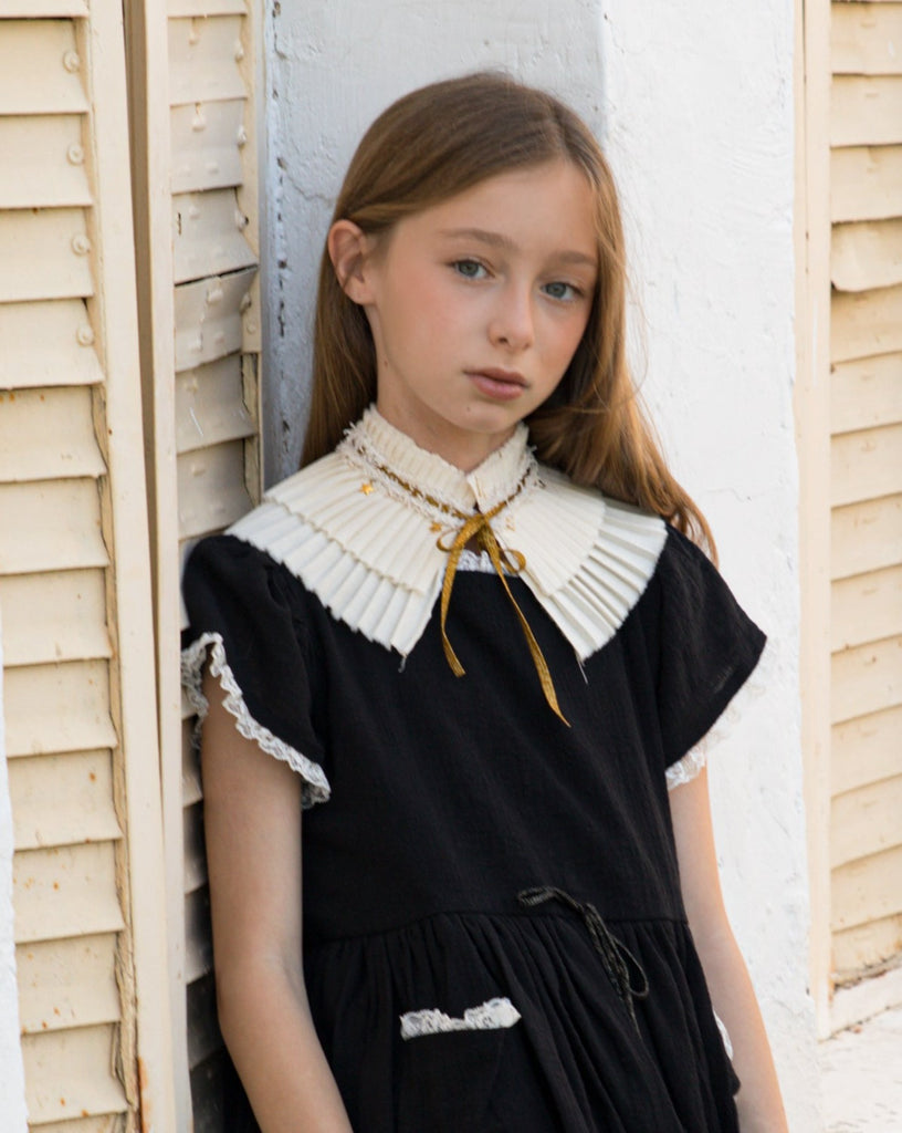 pleated collar with gold bow and stars detail