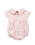 Romper for baby dress in gingham print with flowers. Ruffle neck and gold bow detail. Cosmosophie