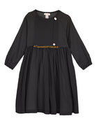 Modest dress in black. Long sleeve. Crossed chest. Velvet and gold detail. European brand dresses