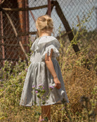 Special occasions dress in light grey. Big peter pan collar. Ruffles on the slevees. Luxury childrens wear eurpean brand