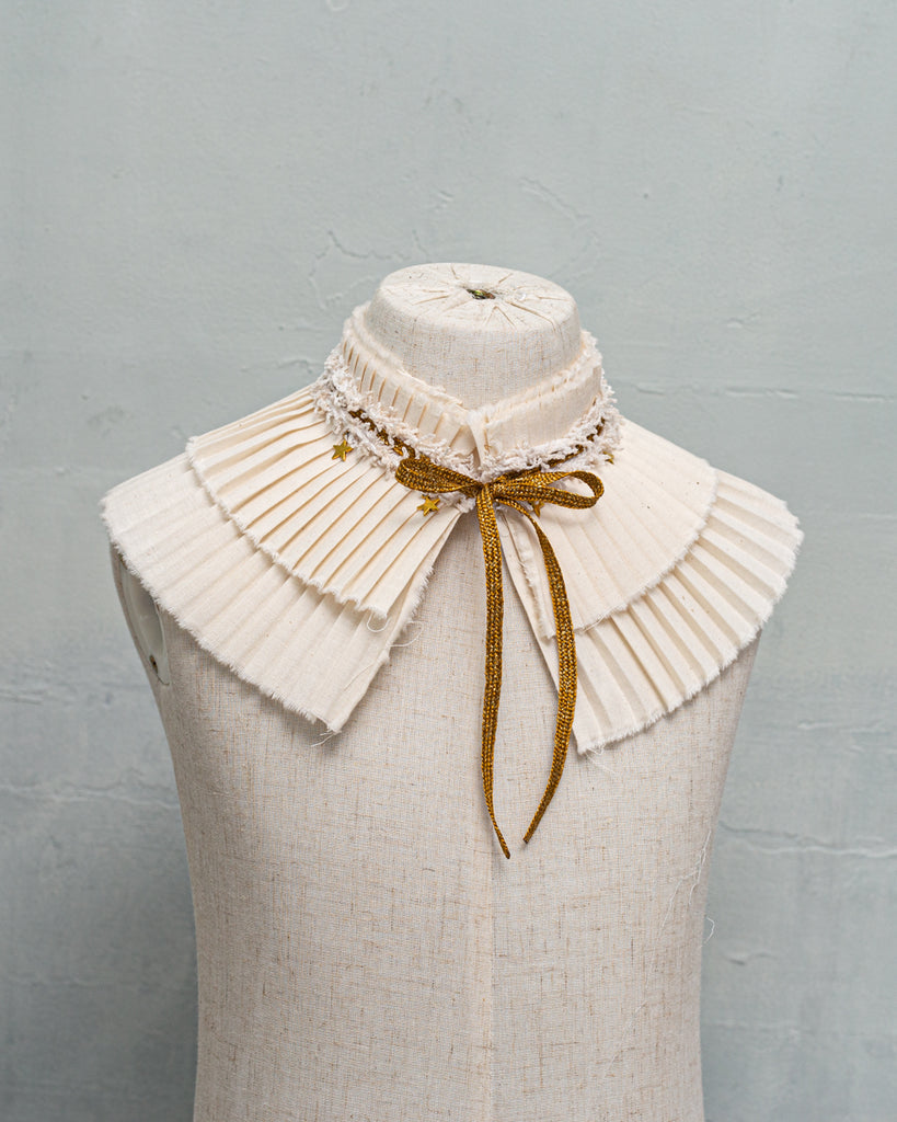 pleated collar with gold bow and stars detail