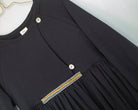 Modest dress in black. Long sleeve. Crossed chest. Velvet and gold detail. European brand dresses