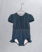 Short sleeve swimsuit in grey with gold detail vintage style. Original swim trunk for girl. European brand luxury kids wear